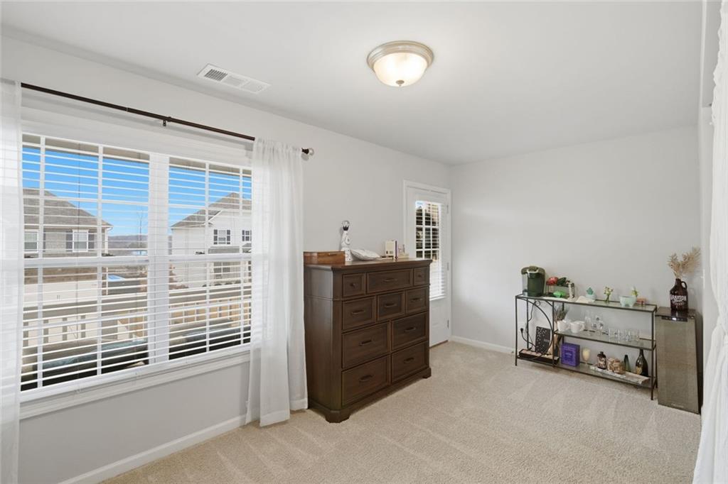 619 Little Bear Loop Canton, GA 30114 - Photo 30 of 39 a view of a bedroom with furniture and windows
