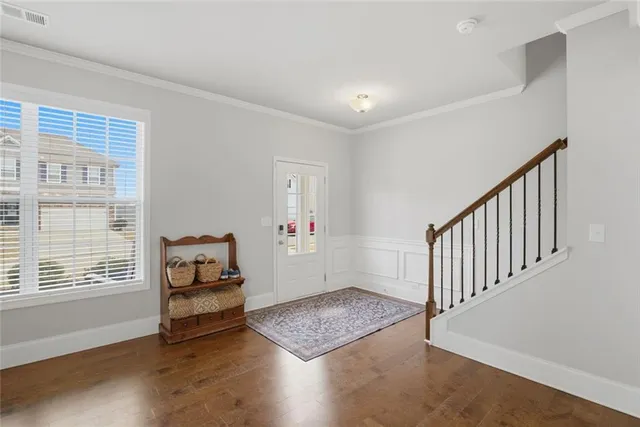 a view of dining room with furniture and wooden floor