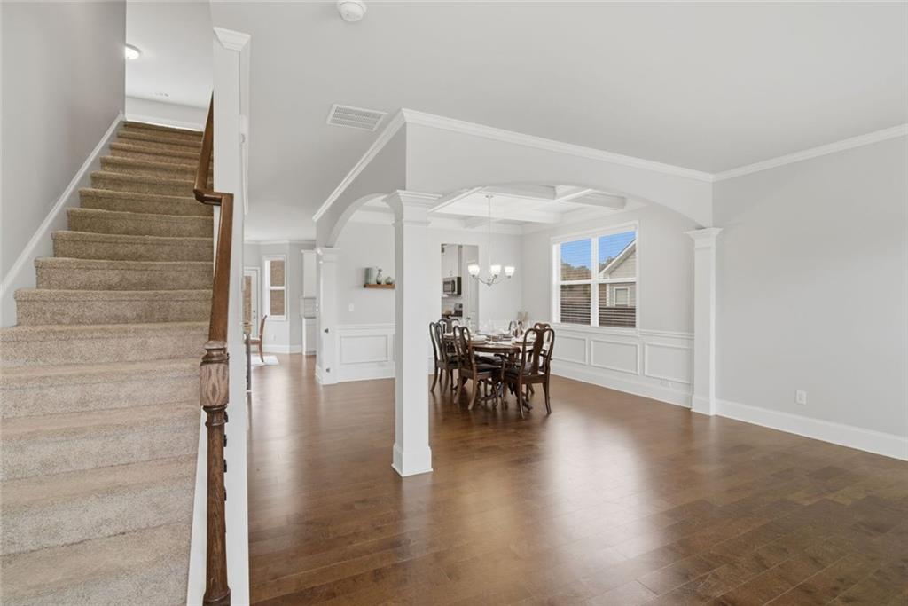 619 Little Bear Loop Canton, GA 30114 - Photo 5 of 39 a view of dining room with furniture and wooden floor