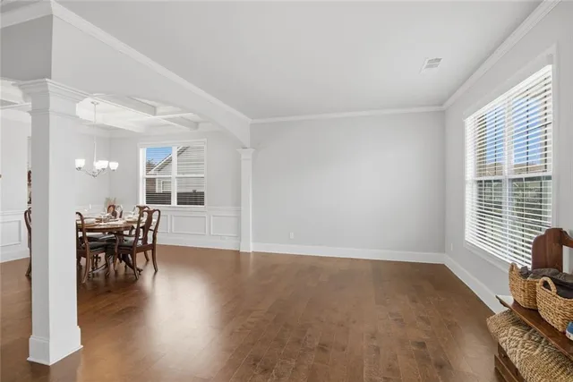 a view of a dining room with furniture and wooden floor