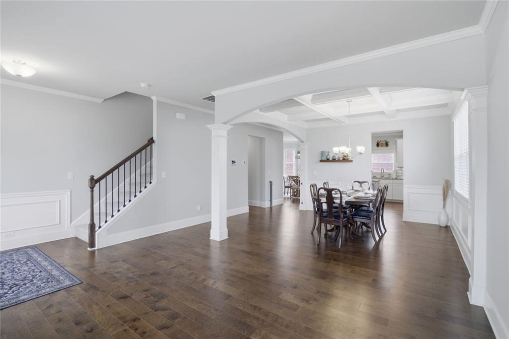 619 Little Bear Loop Canton, GA 30114 - Photo 7 of 39 a view of a dining room with furniture and wooden floor
