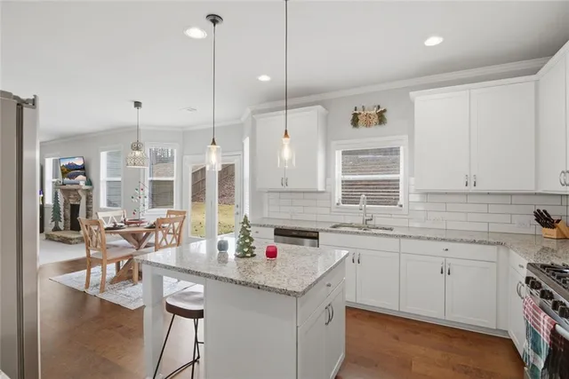 a view of a dining room with furniture and wooden floor