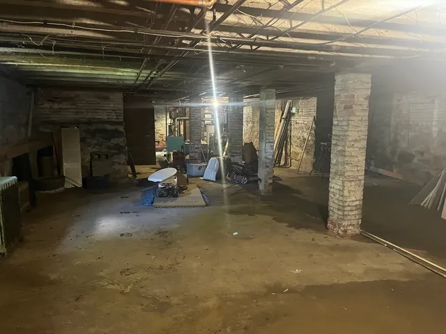 a living room with fireplace furniture and a fireplace