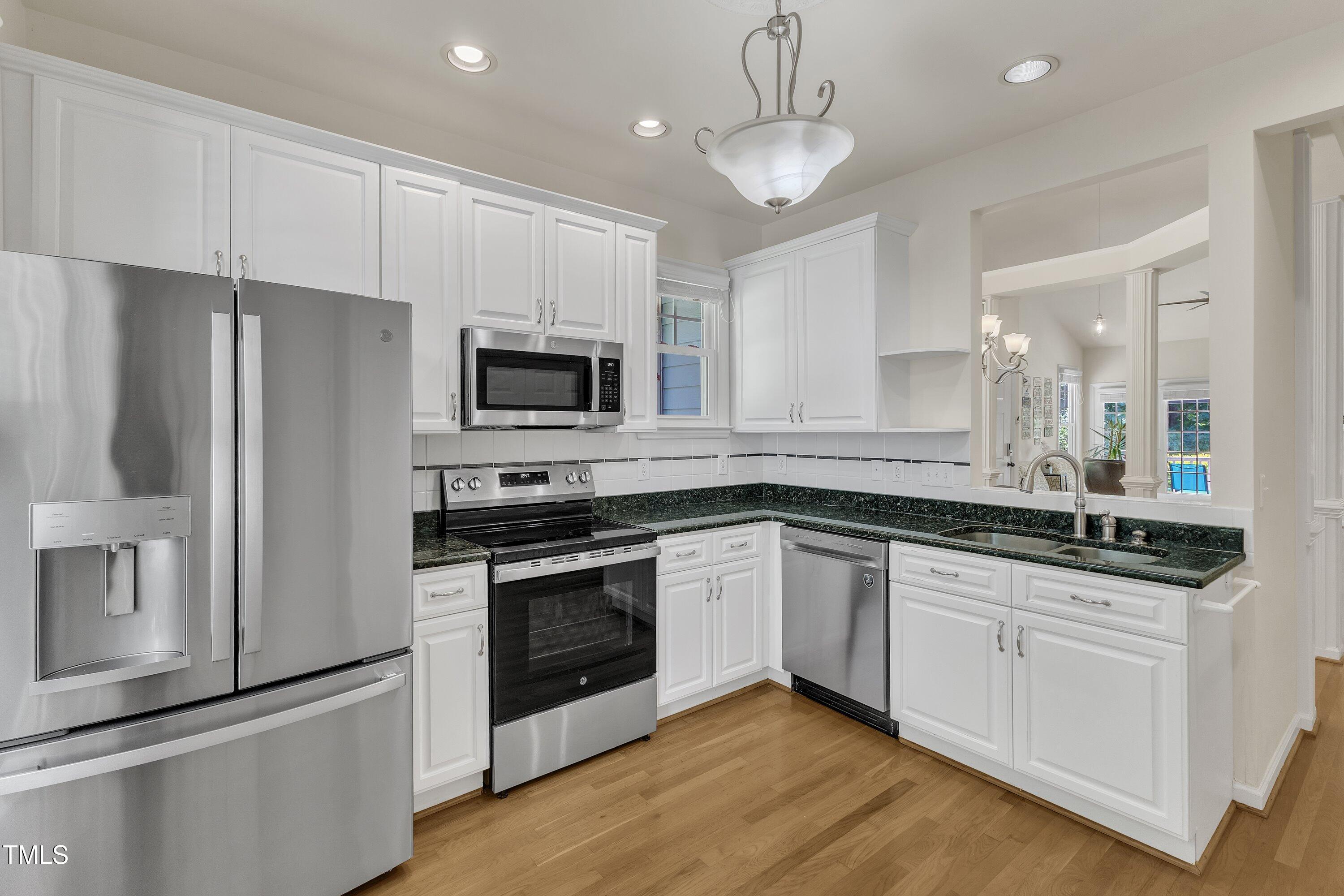 1201 Red Beech Court Raleigh, NC 27614 - Photo 13 of 41 Kitchen opens to the dining room and allows for easy entertaining