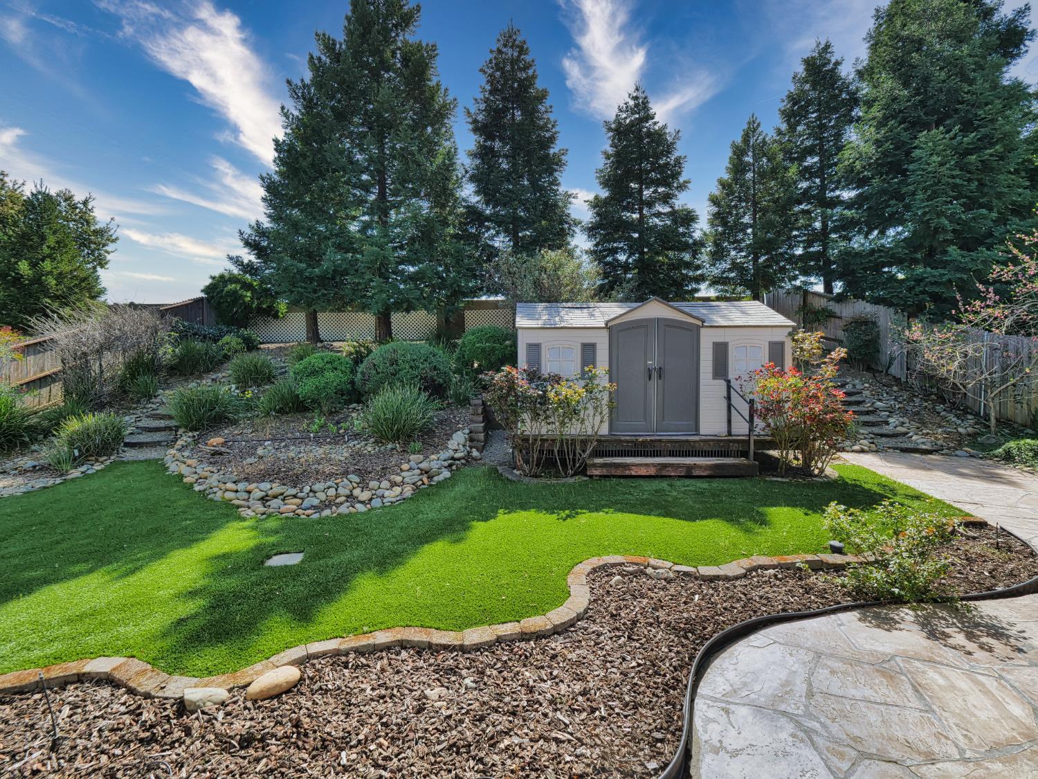 11864 South Carson Way Gold River, CA 95670 - Photo 12 of 69 a view of a house with a backyard and garden