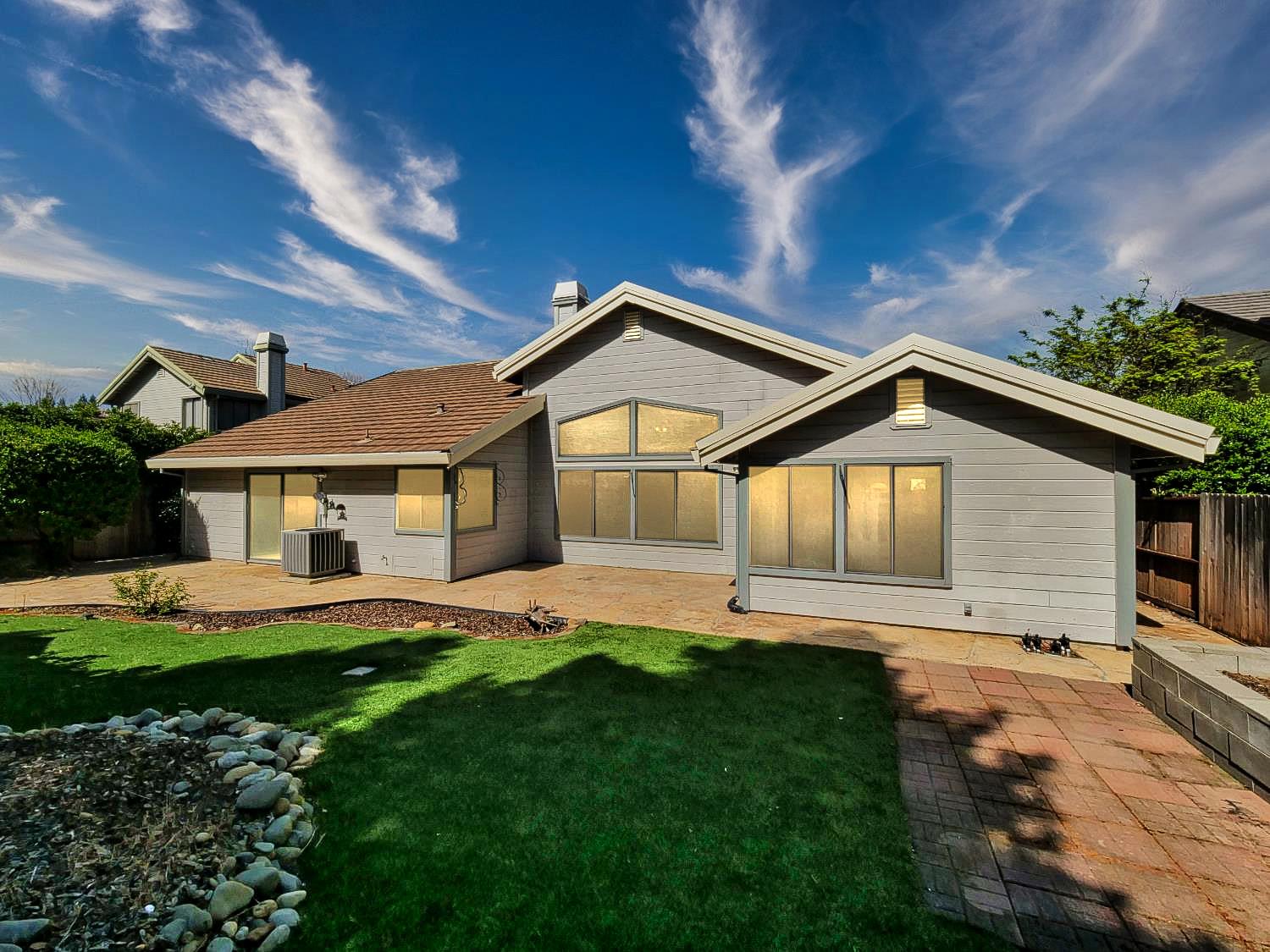 11864 South Carson Way Gold River, CA 95670 - Photo 14 of 69 a front view of a house with a yard and garage
