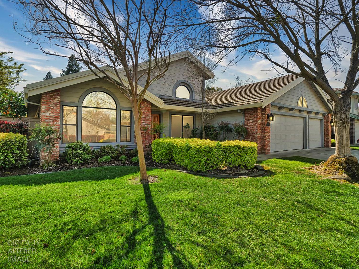 11864 South Carson Way Gold River, CA 95670 - Photo 2 of 69 a front view of a house with garden