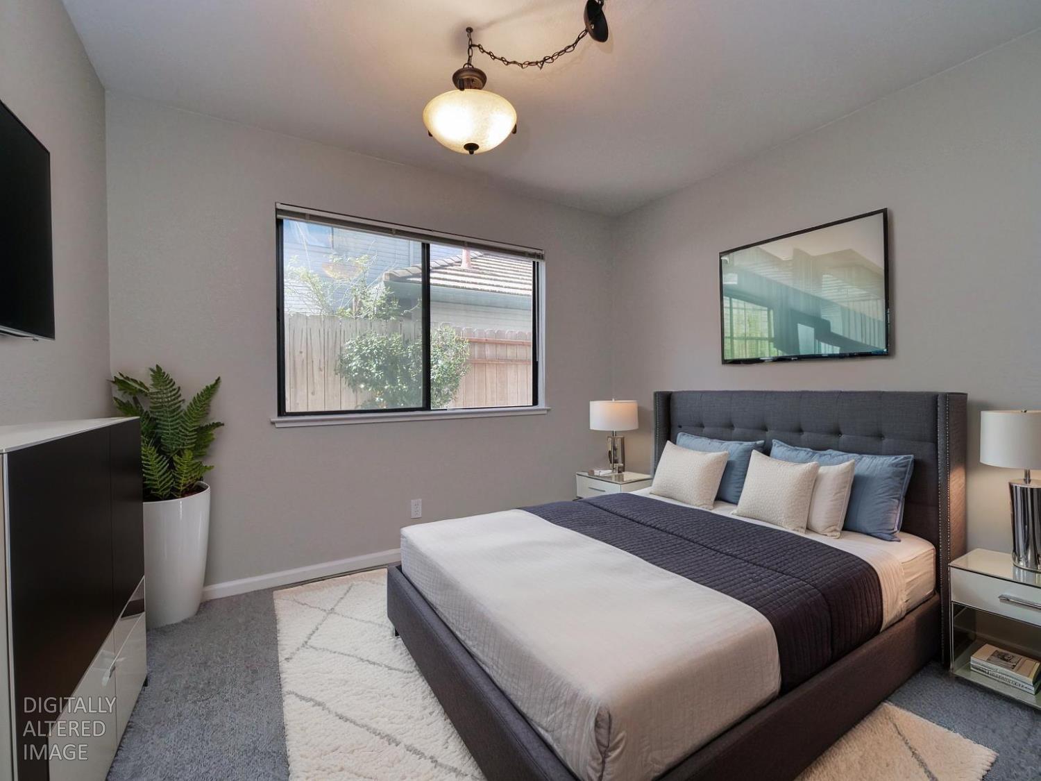 11864 South Carson Way Gold River, CA 95670 - Photo 47 of 69 a bedroom with bed and a potted plant