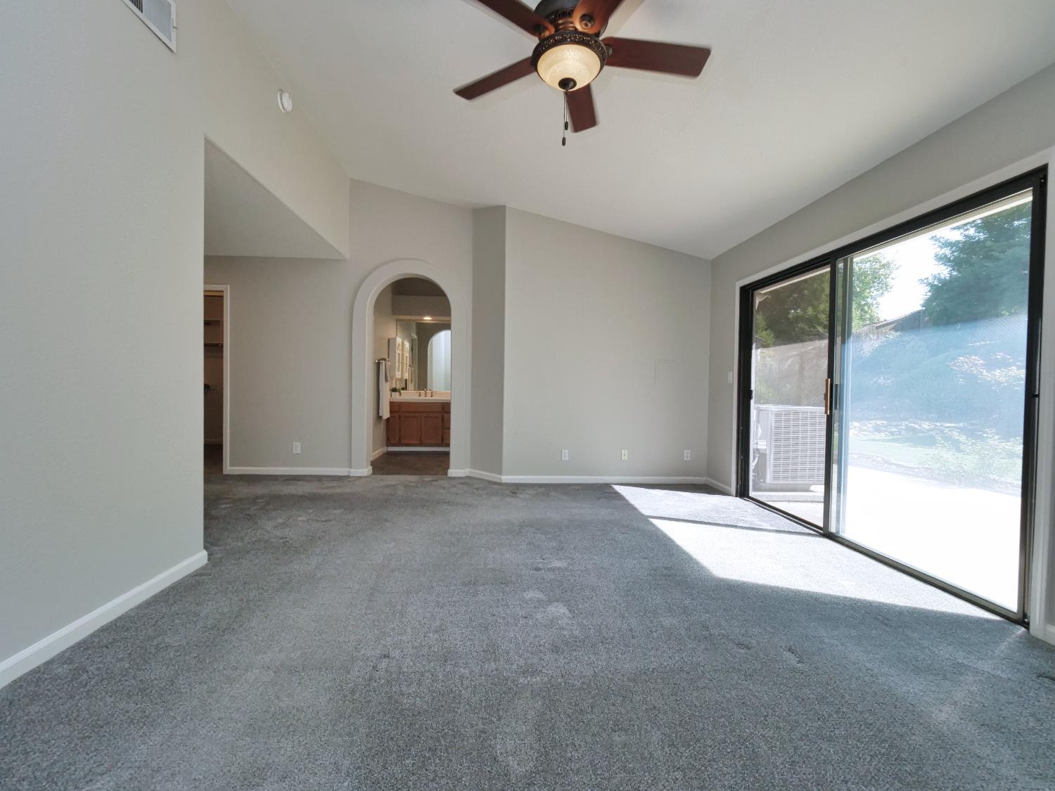 11864 South Carson Way Gold River, CA 95670 - Photo 52 of 69 a view of a livingroom with a ceiling fan and window