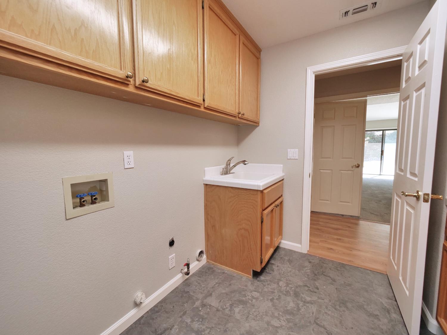 11864 South Carson Way Gold River, CA 95670 - Photo 65 of 69 a view of a refrigerator in kitchen and utility room