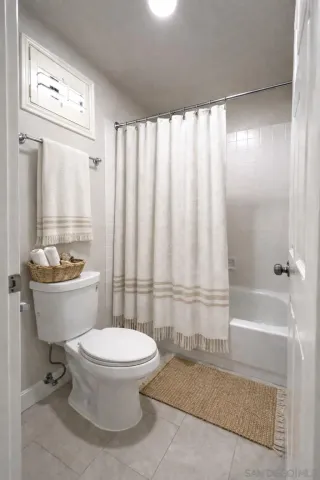 a bathroom with a toilet a sink and a bathtub
