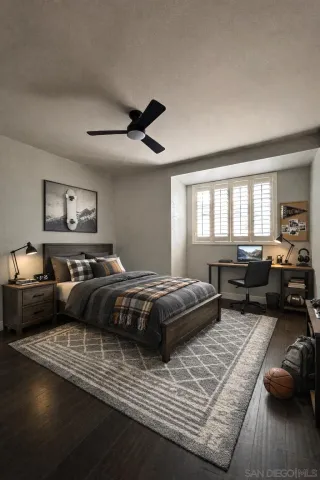 a bedroom with furniture and a large window