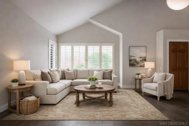 a living room with furniture a rug and a large window