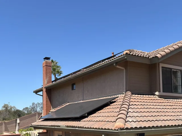 a bathroom with a tub and shower