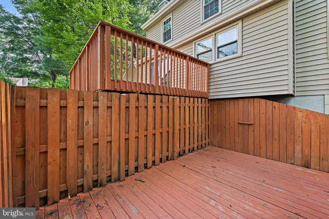 a backyard of a house with wooden fence