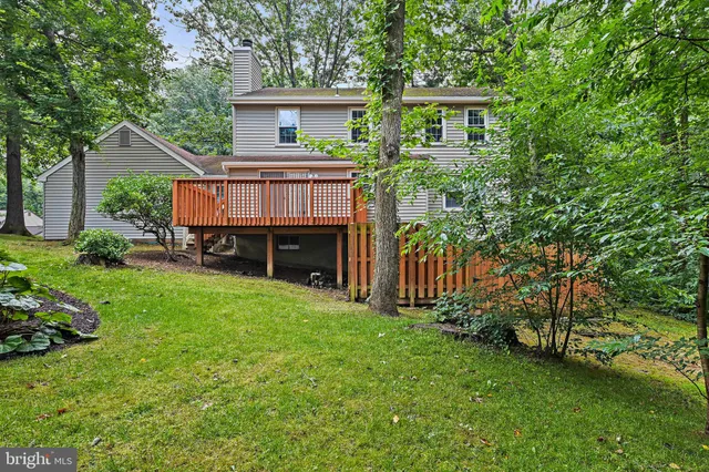 a view of house with yard and entertaining space