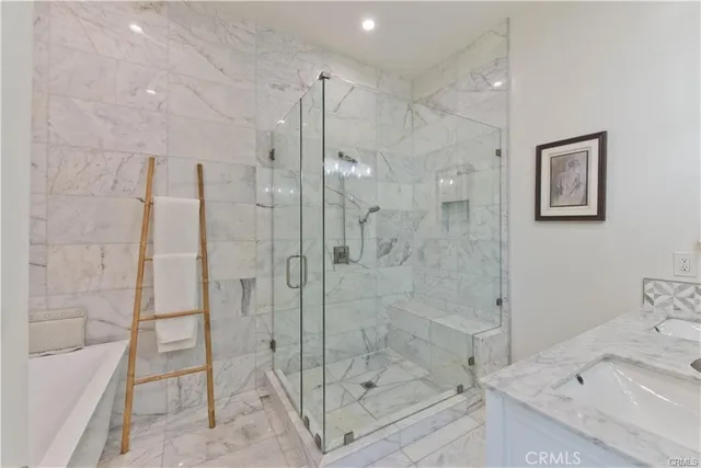 a bathroom with a shower and a bath tub