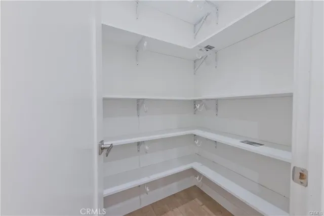 a view of an empty walk in closet