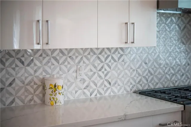 a bathroom with a sink a light fixture and a mirror