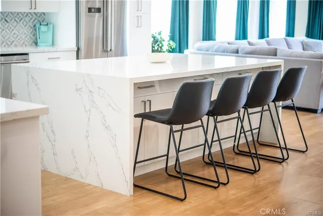 a dining room with granite countertop furniture and a window