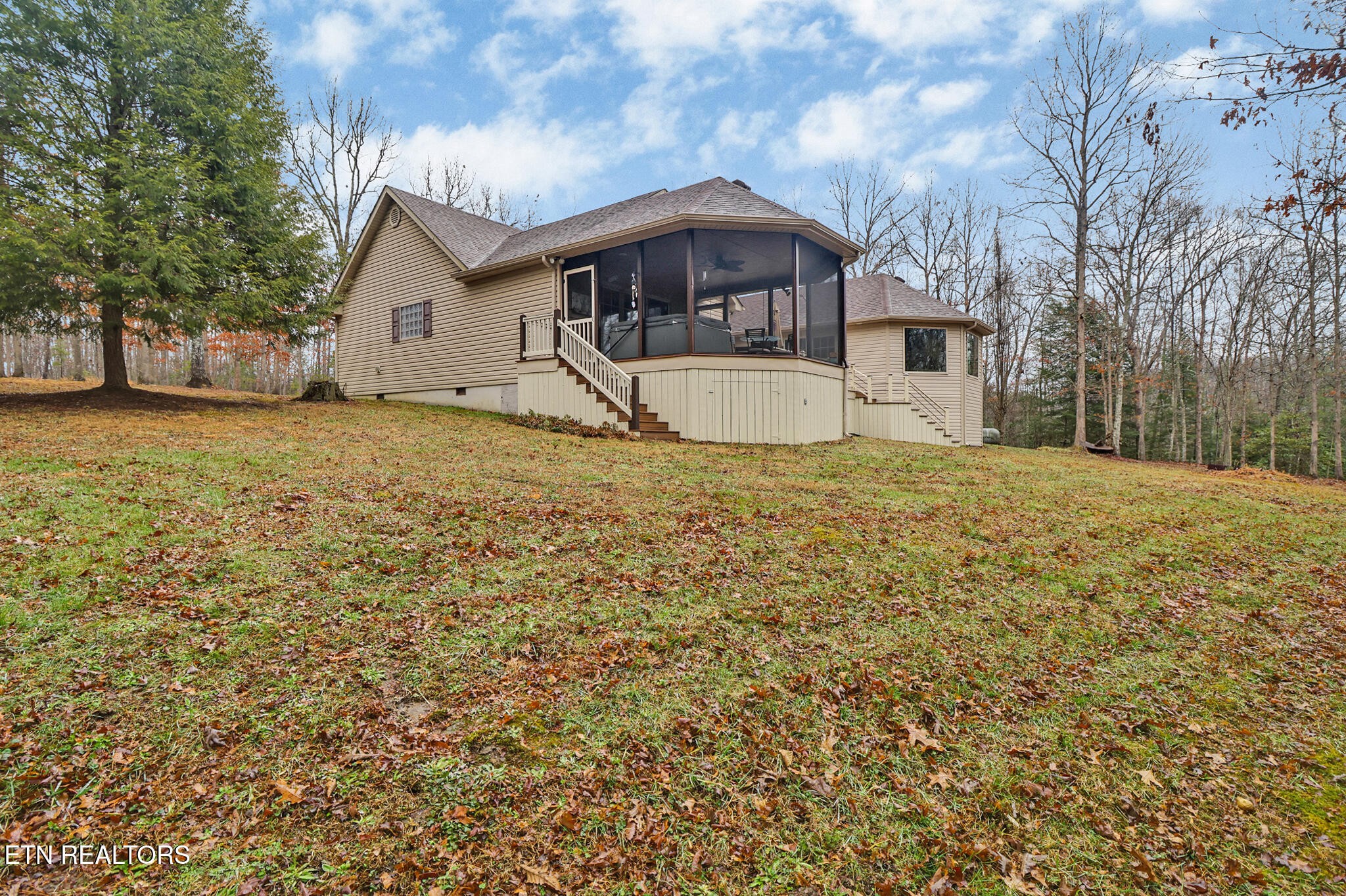 224 Victoria Circle Jamestown, TN 38556 - Photo 13 of 52 a front view of a house with a yard garage and outdoor seating