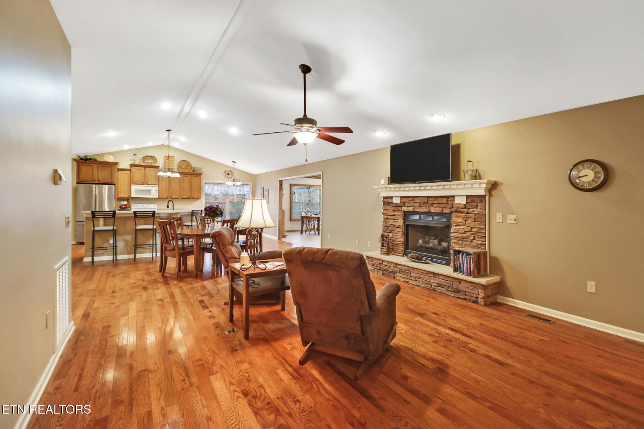 224 Victoria Circle Jamestown, TN 38556 - Photo 27 of 52 a living room with furniture a fireplace and a flat screen tv