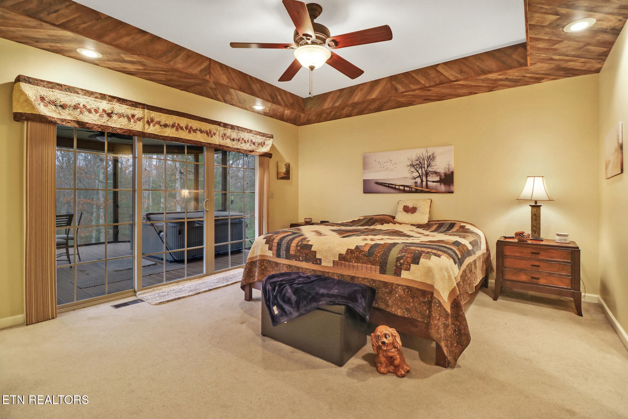 224 Victoria Circle Jamestown, TN 38556 - Photo 41 of 52 a spacious bedroom with a bed and a chandelier