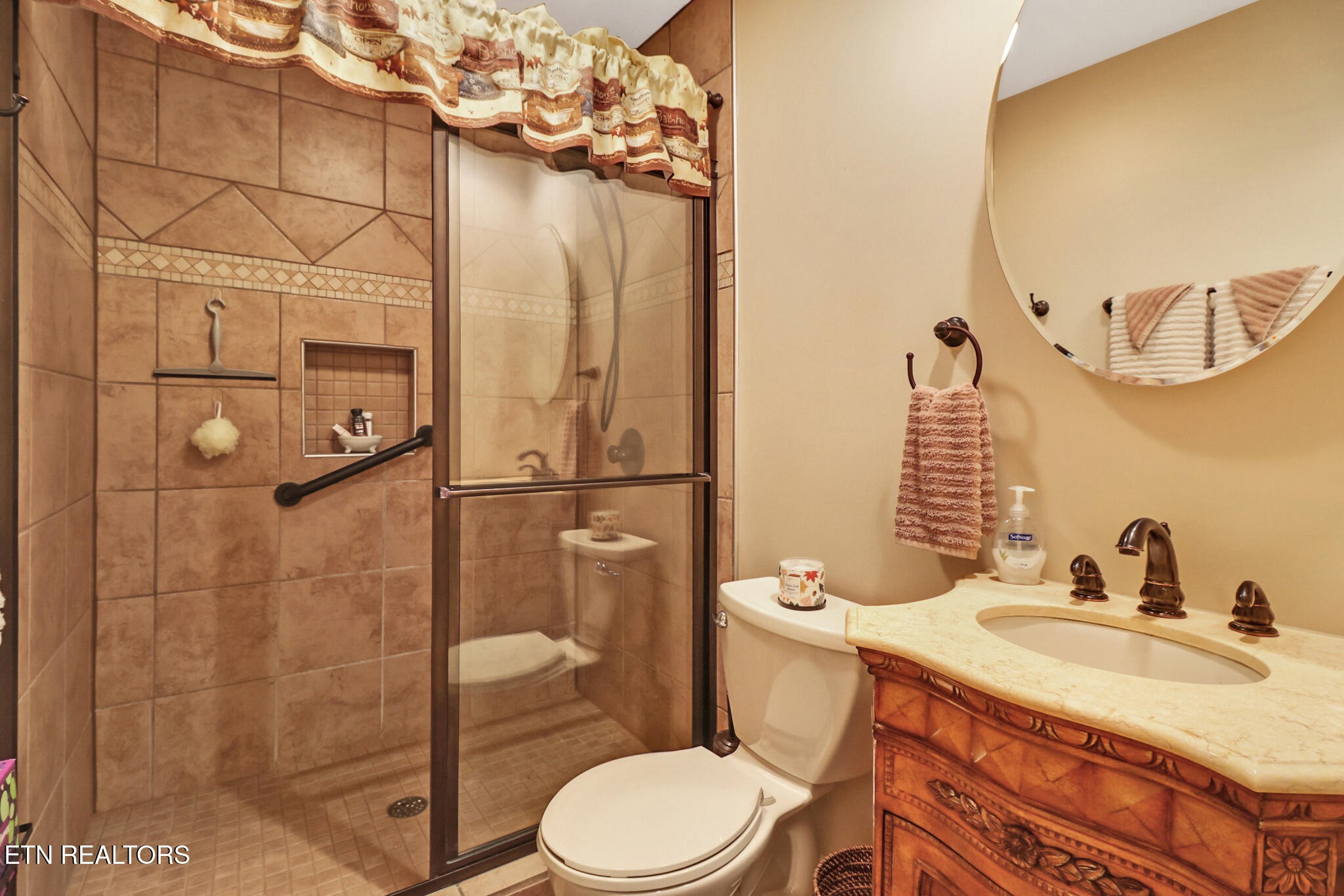 224 Victoria Circle Jamestown, TN 38556 - Photo 49 of 52 a bathroom with a sink a toilet and shower