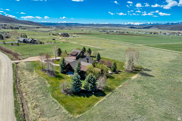 2579 Splendor Valley Road Kamas, UT 84036 - Photo 29 of 87 Aerial view of sparsely populated area with a mountain backdrop and agricultural land