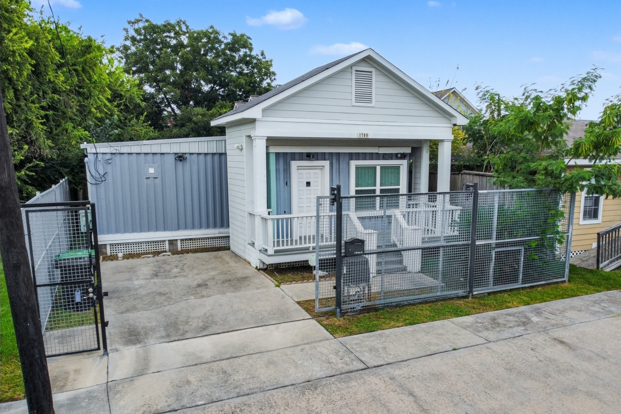 1709 Dan Street Houston, TX 77020 - Photo 2 of 29 a view of house with backyard outdoor seating and trees