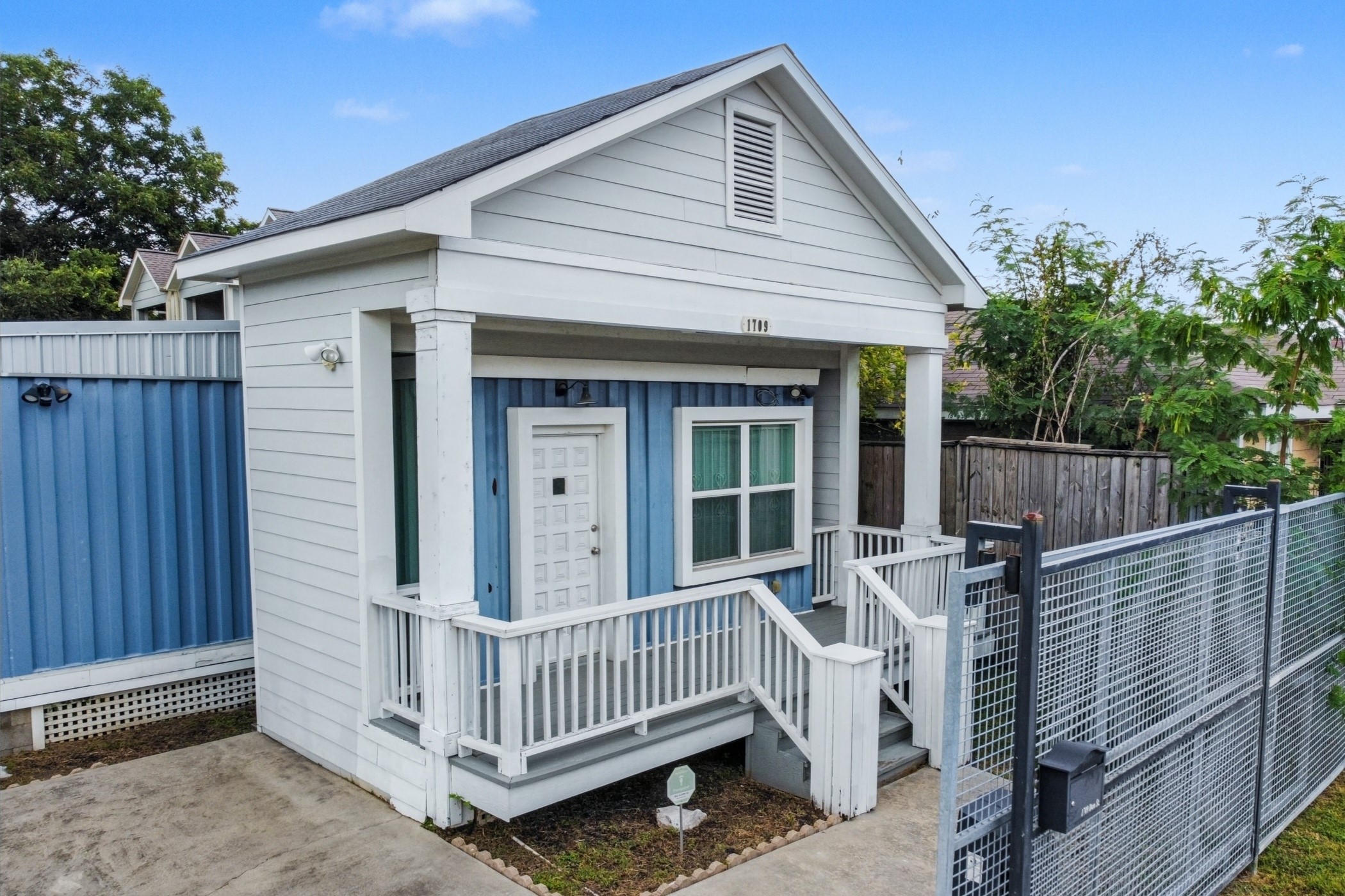 1709 Dan Street Houston, TX 77020 - Photo 6 of 29 a view of a white house with a small yard and wooden fence