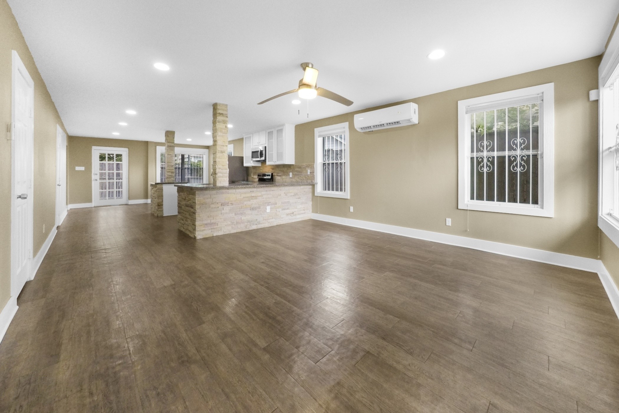 1709 Dan Street Houston, TX 77020 - Photo 10 of 29 a view of a big room with wooden floor and windows