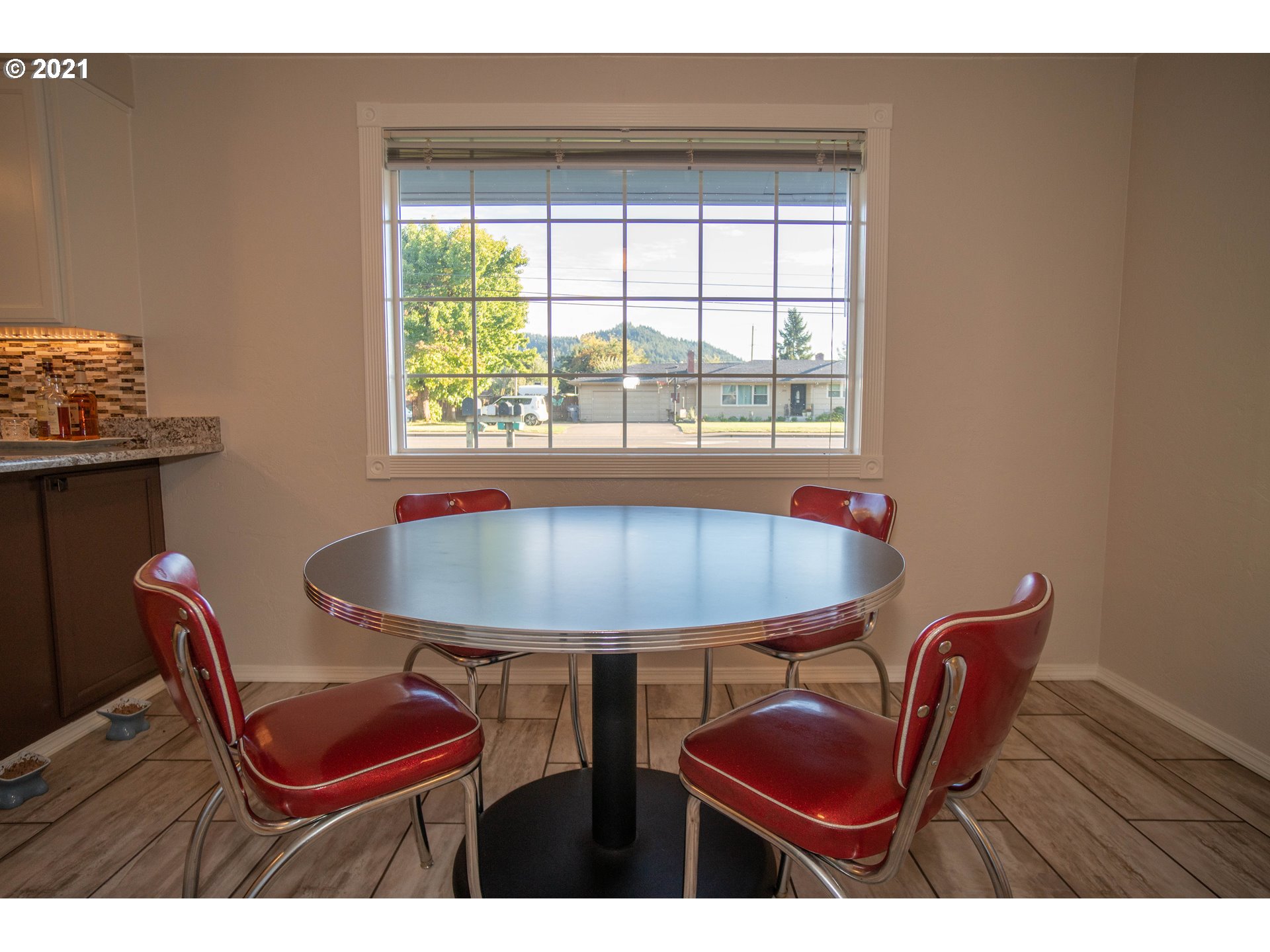 3950 Jasper Road Springfield, OR 97478 - Photo 6 of 20 a view of a dining room with furniture and window