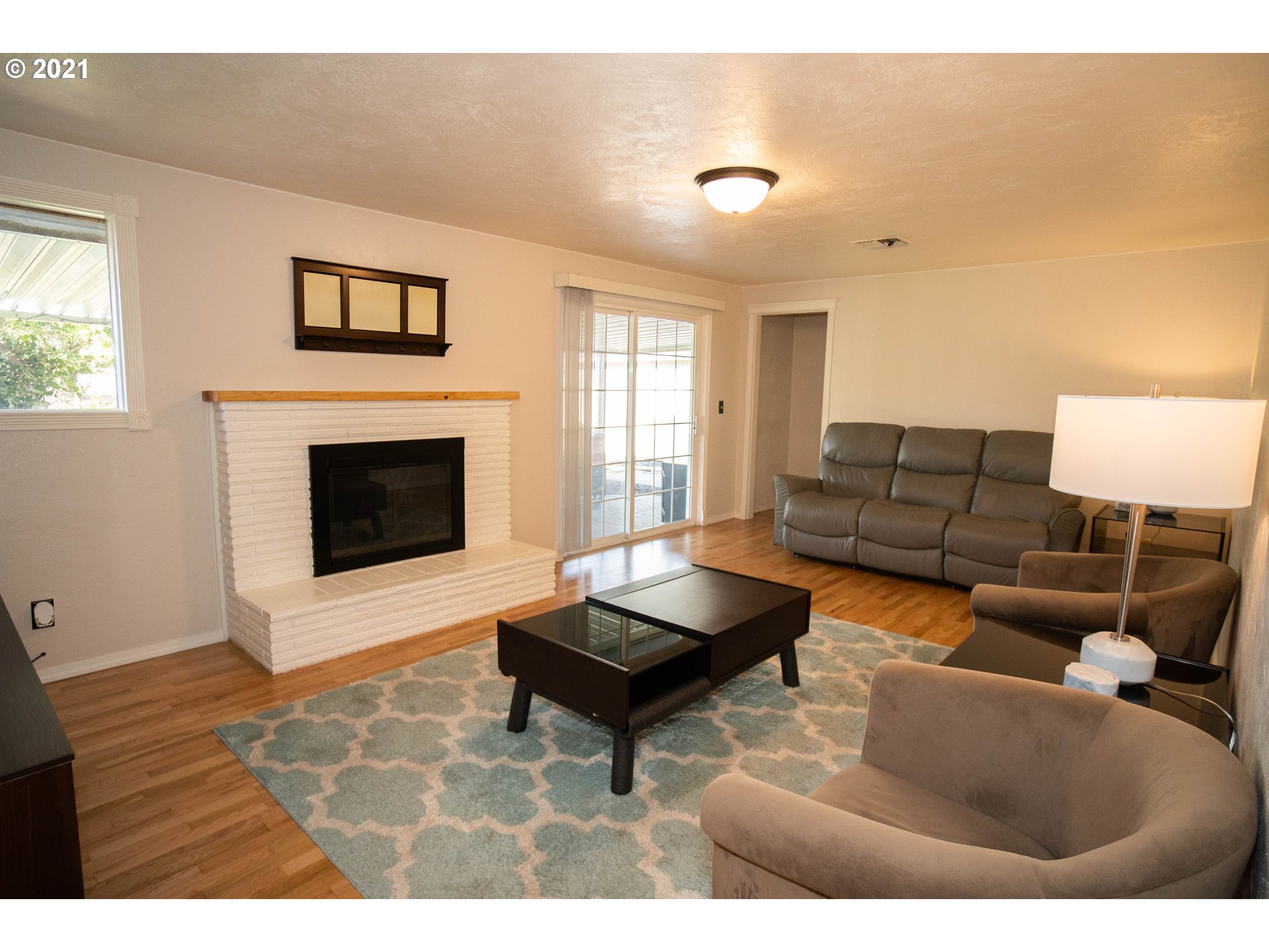 3950 Jasper Road Springfield, OR 97478 - Photo 7 of 20 a living room with furniture and a flat screen tv