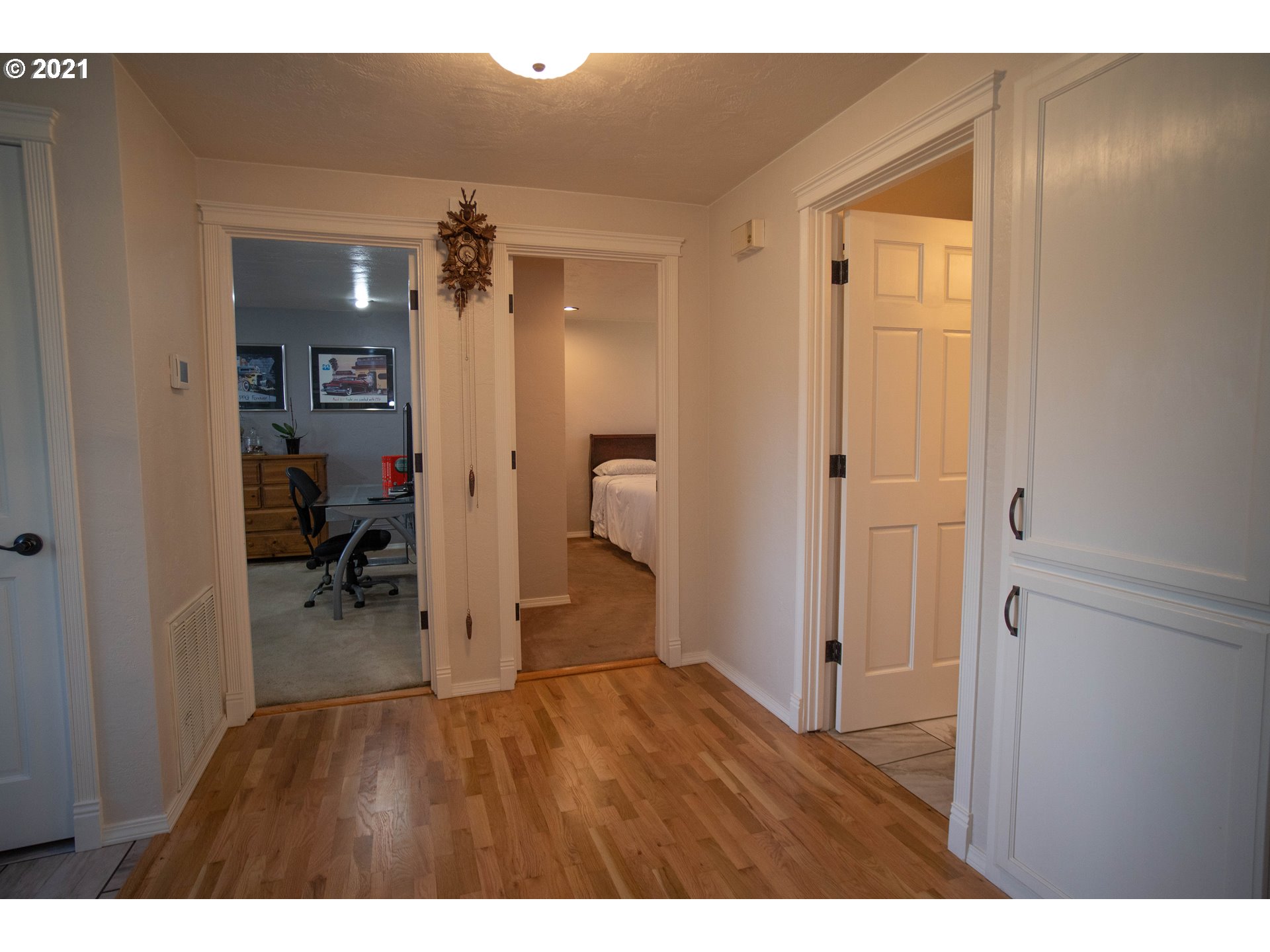 3950 Jasper Road Springfield, OR 97478 - Photo 8 of 20 a view of a hallway and a livingroom with furniture