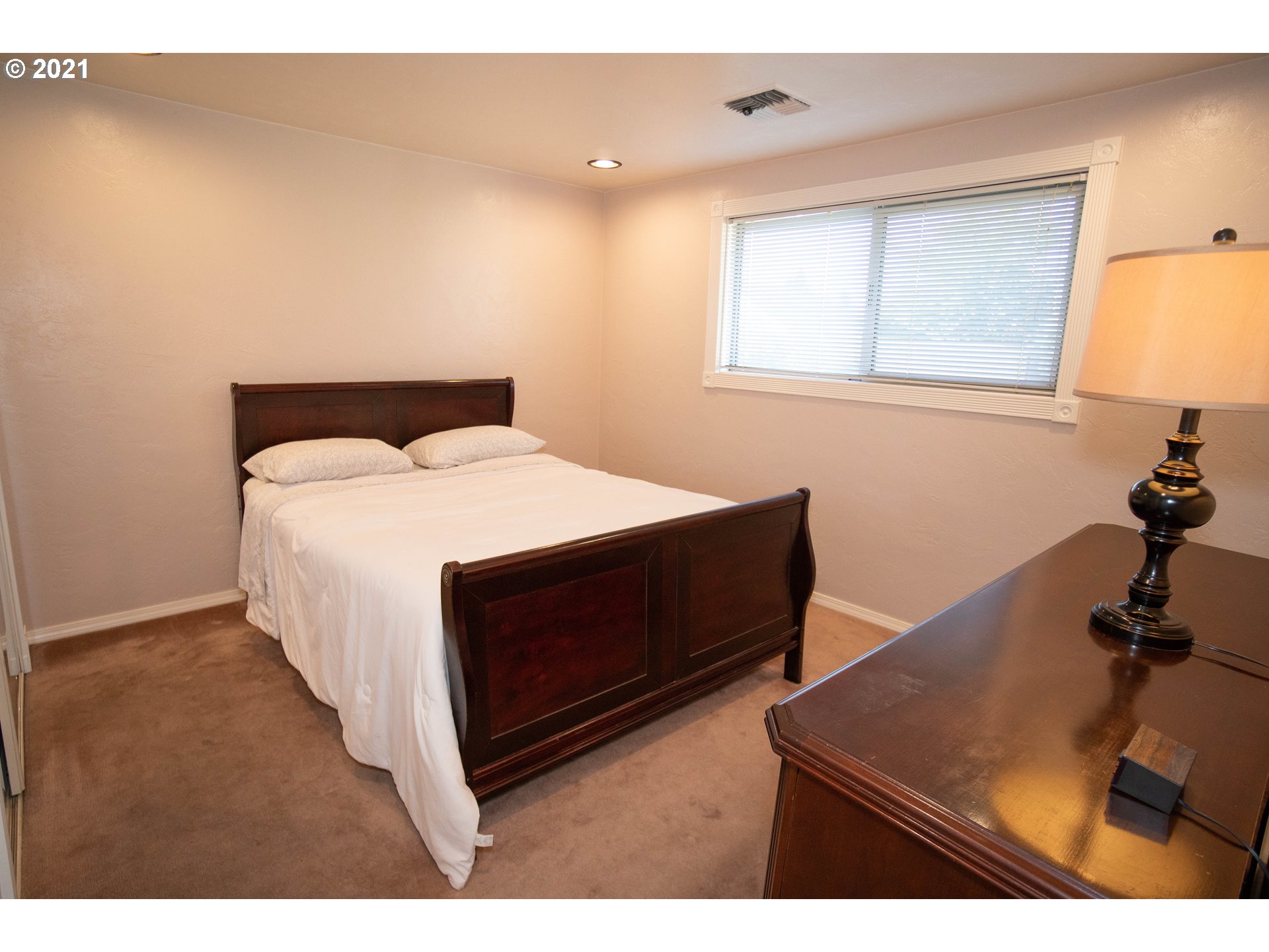 3950 Jasper Road Springfield, OR 97478 - Photo 9 of 20 a bed room with a bed and a night stand