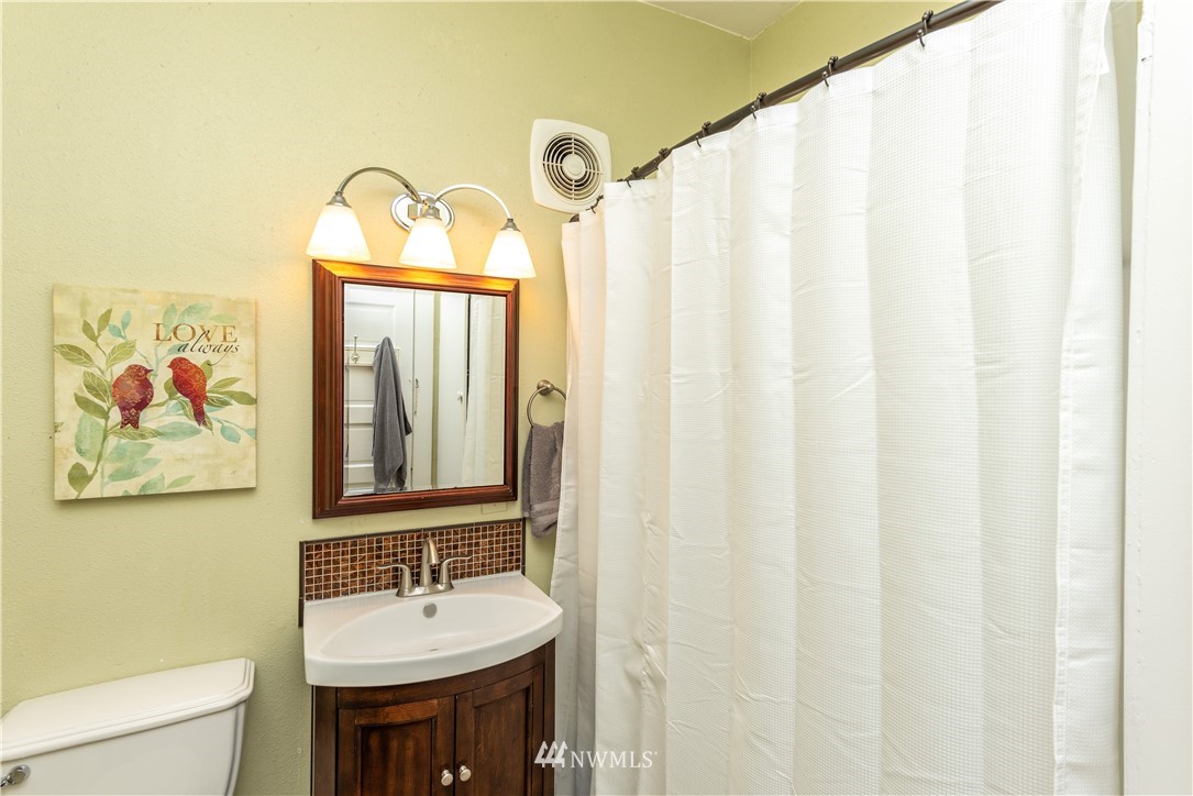 324 N Street Centralia, WA 98531 - Photo 14 of 32 a bathroom with a sink and a mirror