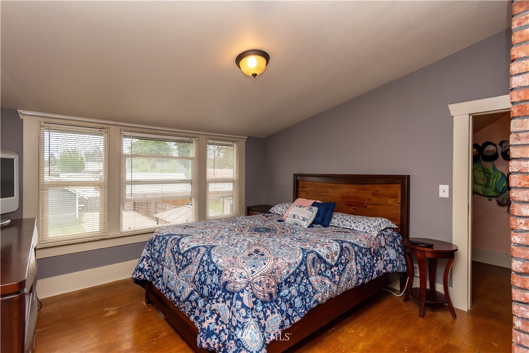 324 N Street Centralia, WA 98531 - Photo 18 of 32 a bedroom with a bed and a window