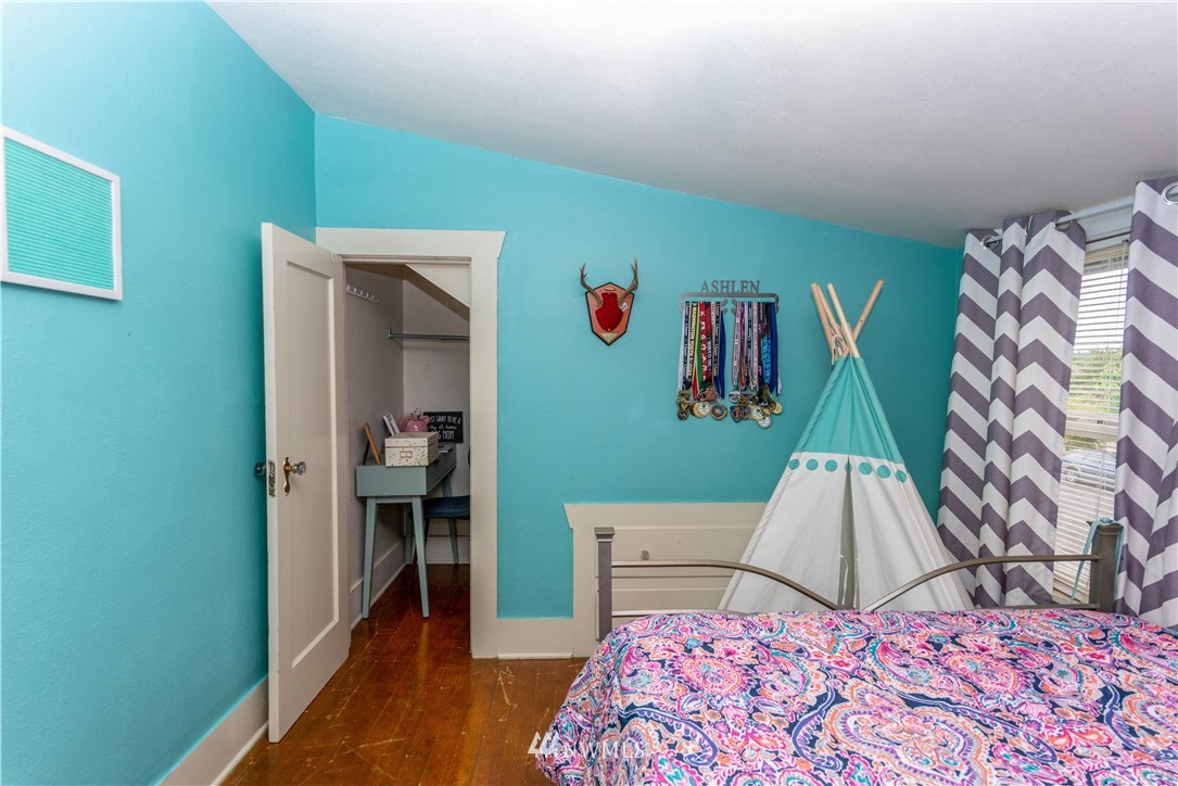 324 N Street Centralia, WA 98531 - Photo 19 of 32 a bedroom with a bed and a wooden floor