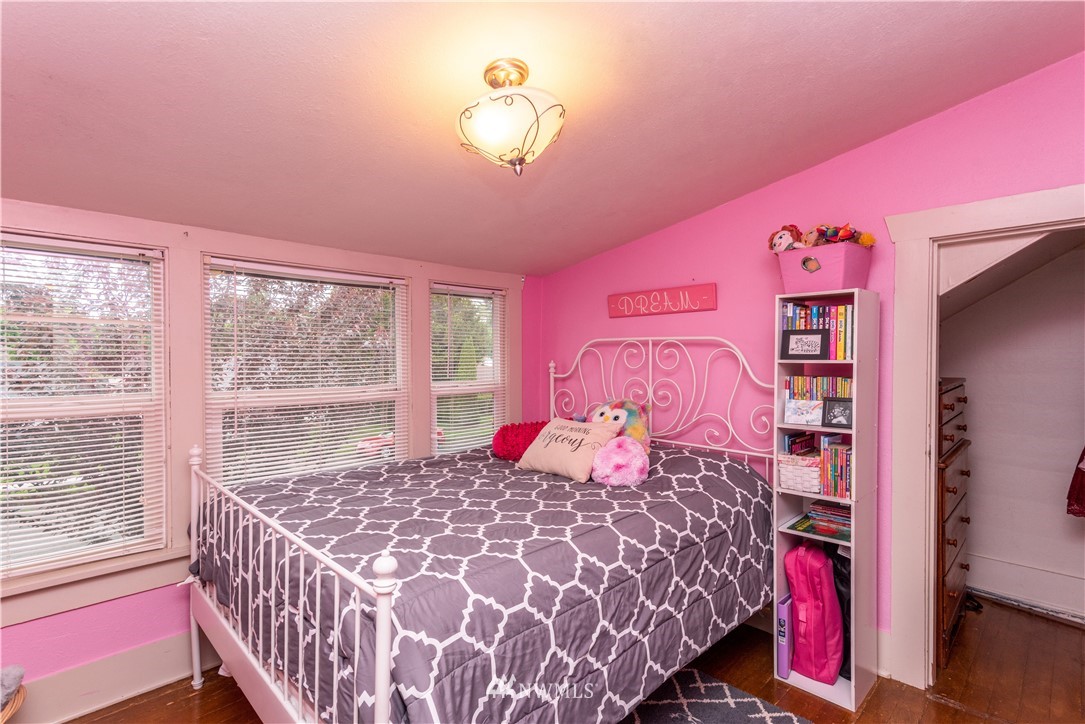 324 N Street Centralia, WA 98531 - Photo 21 of 32 a bedroom with a bed and a large window with the kitchen view