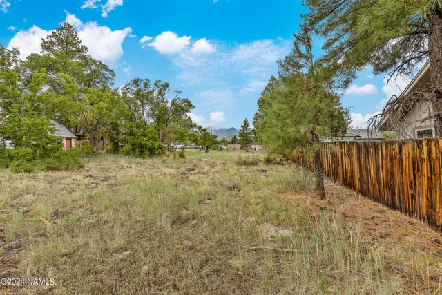 a view of balcony with wooden fence