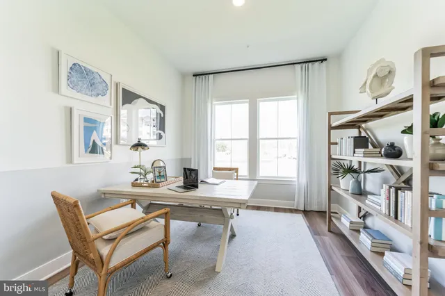a dining room with furniture and a window