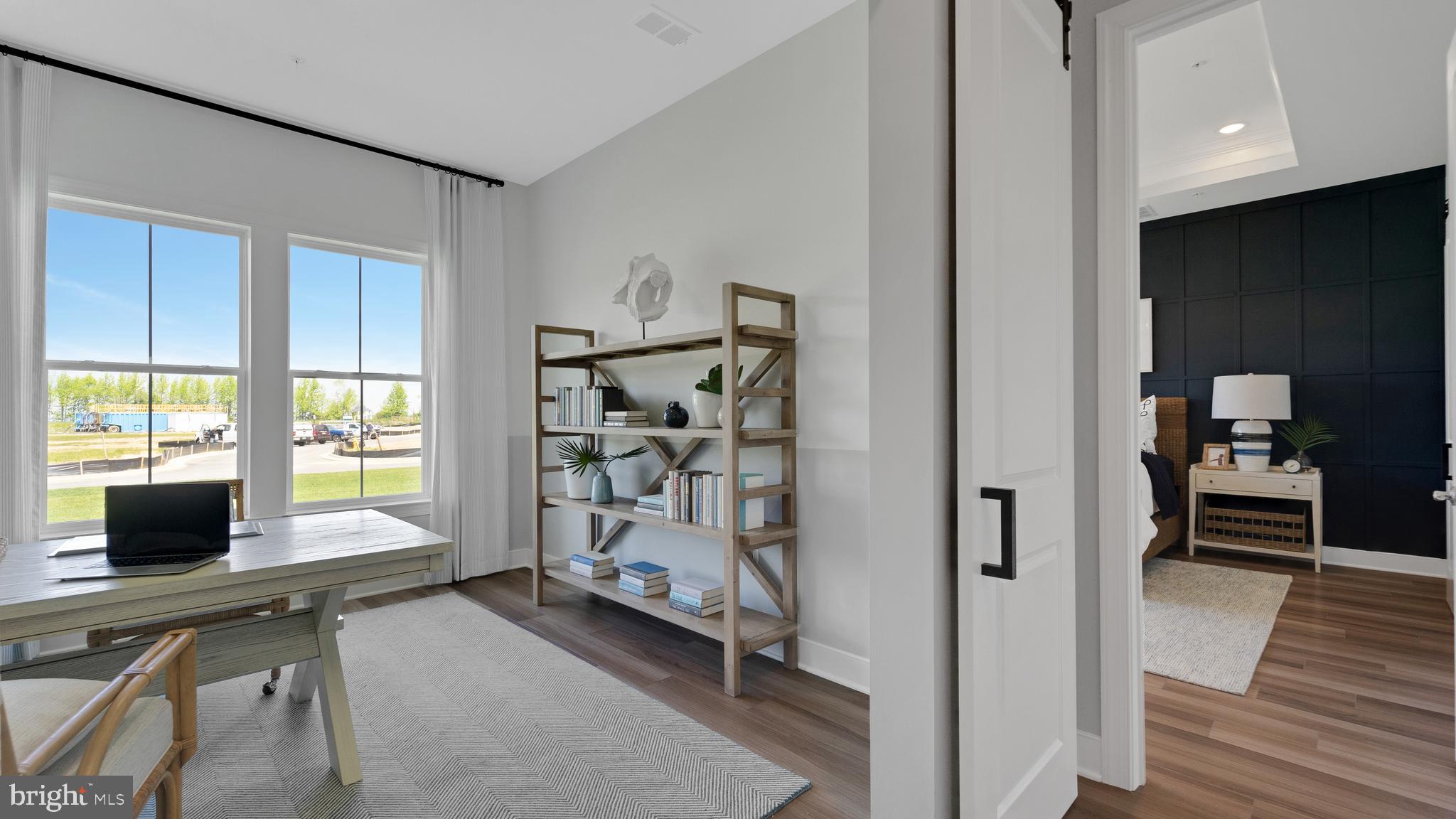 117 Flycatcher Way Stevensville, MD 21666 - Photo 12 of 49 a view of a livingroom with workspace and a window