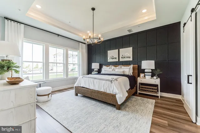 a bedroom with bed and window