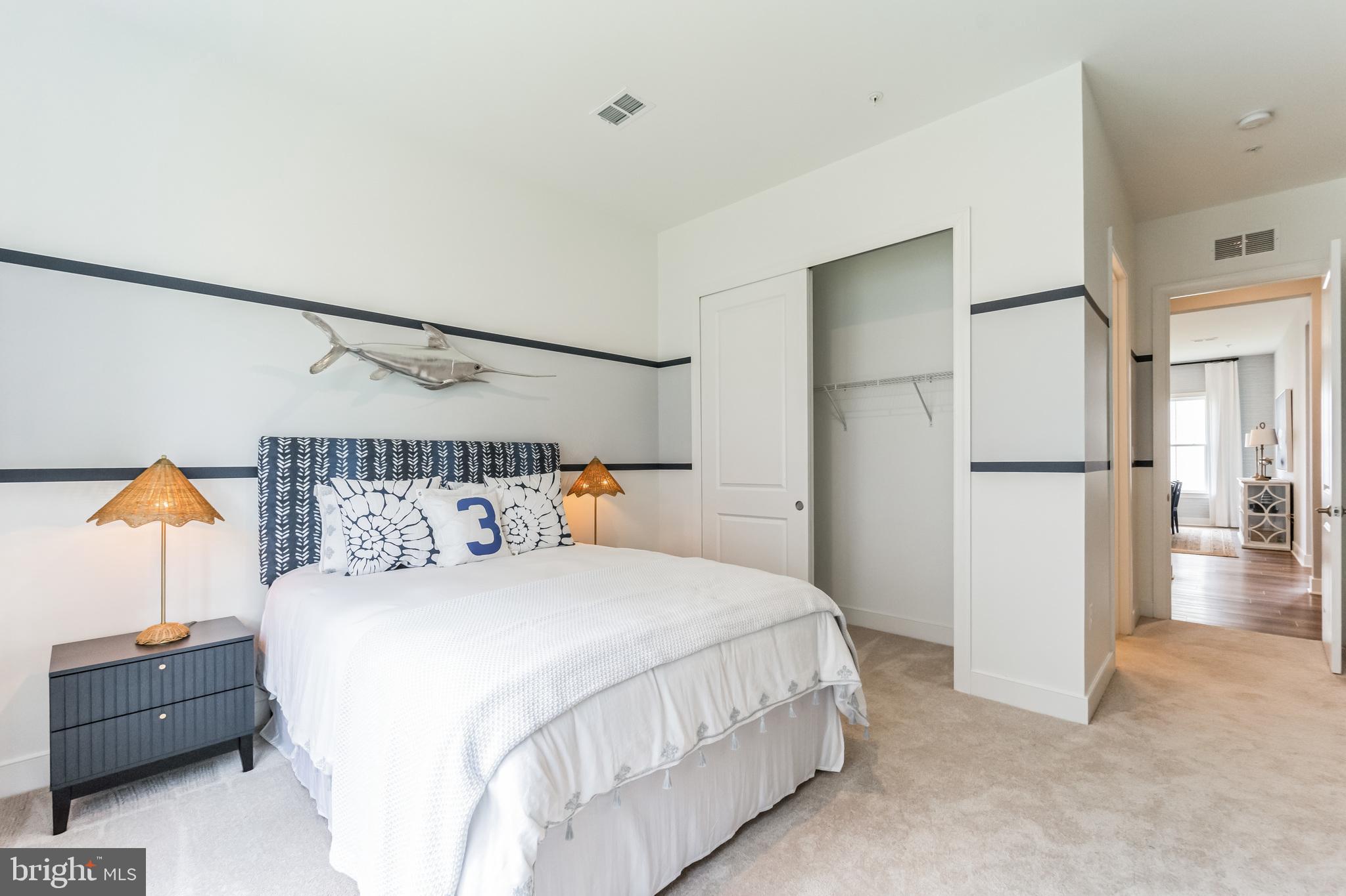 117 Flycatcher Way Stevensville, MD 21666 - Photo 21 of 49 a bedroom with a bed and a table