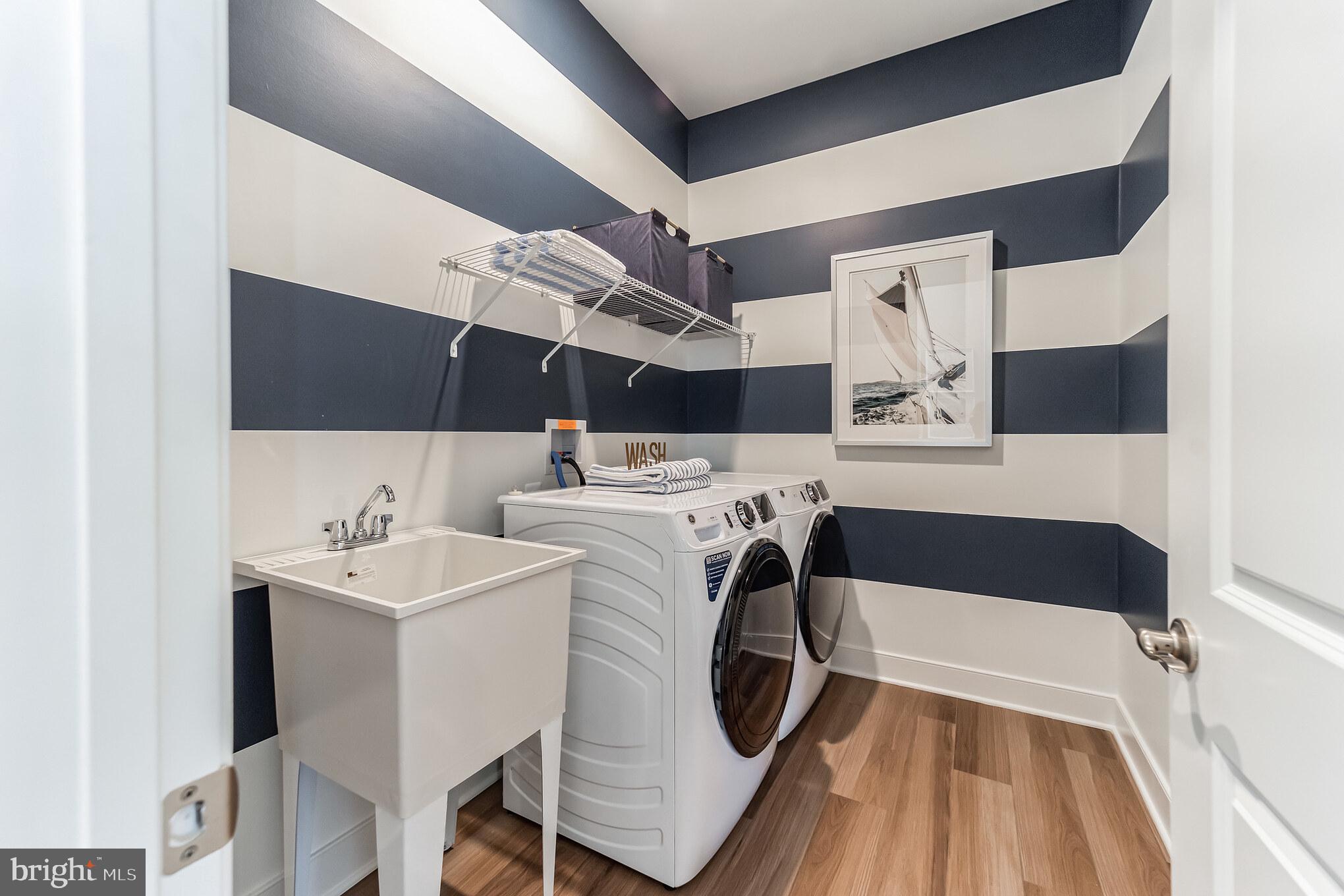117 Flycatcher Way Stevensville, MD 21666 - Photo 23 of 49 a utility room with dryer and washer
