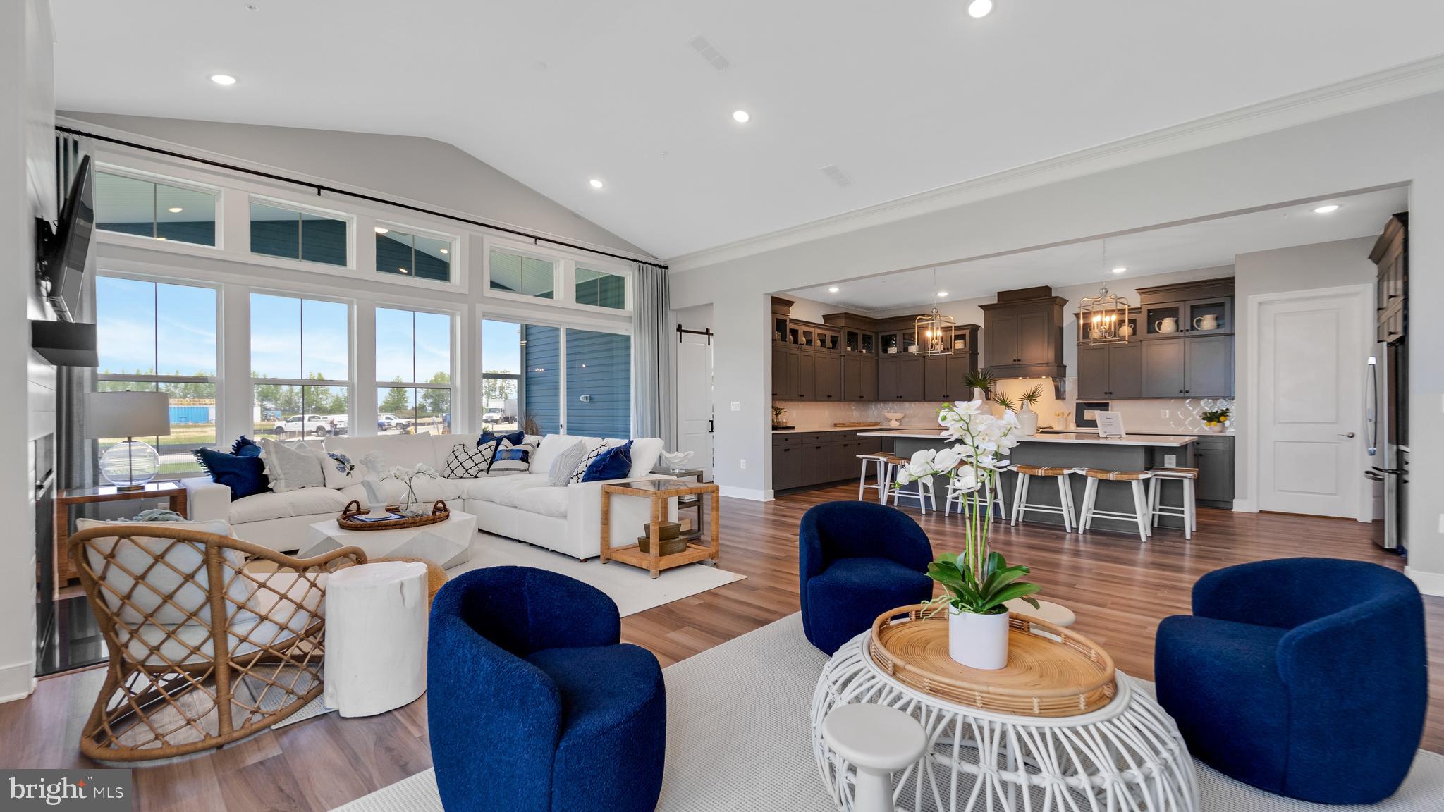117 Flycatcher Way Stevensville, MD 21666 - Photo 5 of 49 a living room with furniture fireplace and a large window