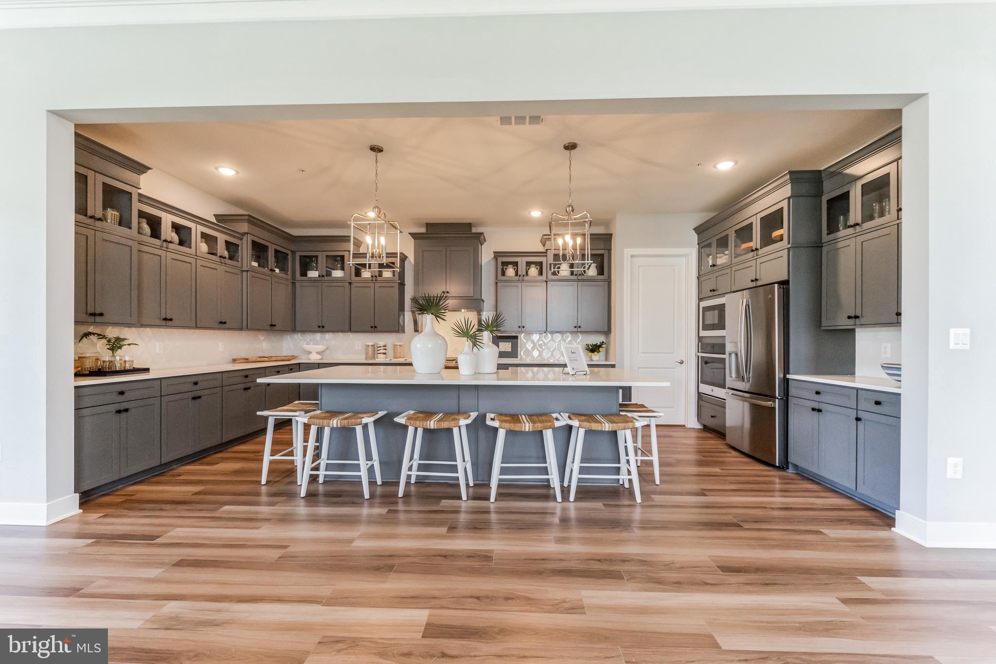 117 Flycatcher Way Stevensville, MD 21666 - Photo 7 of 49 a large kitchen with a table and chairs
