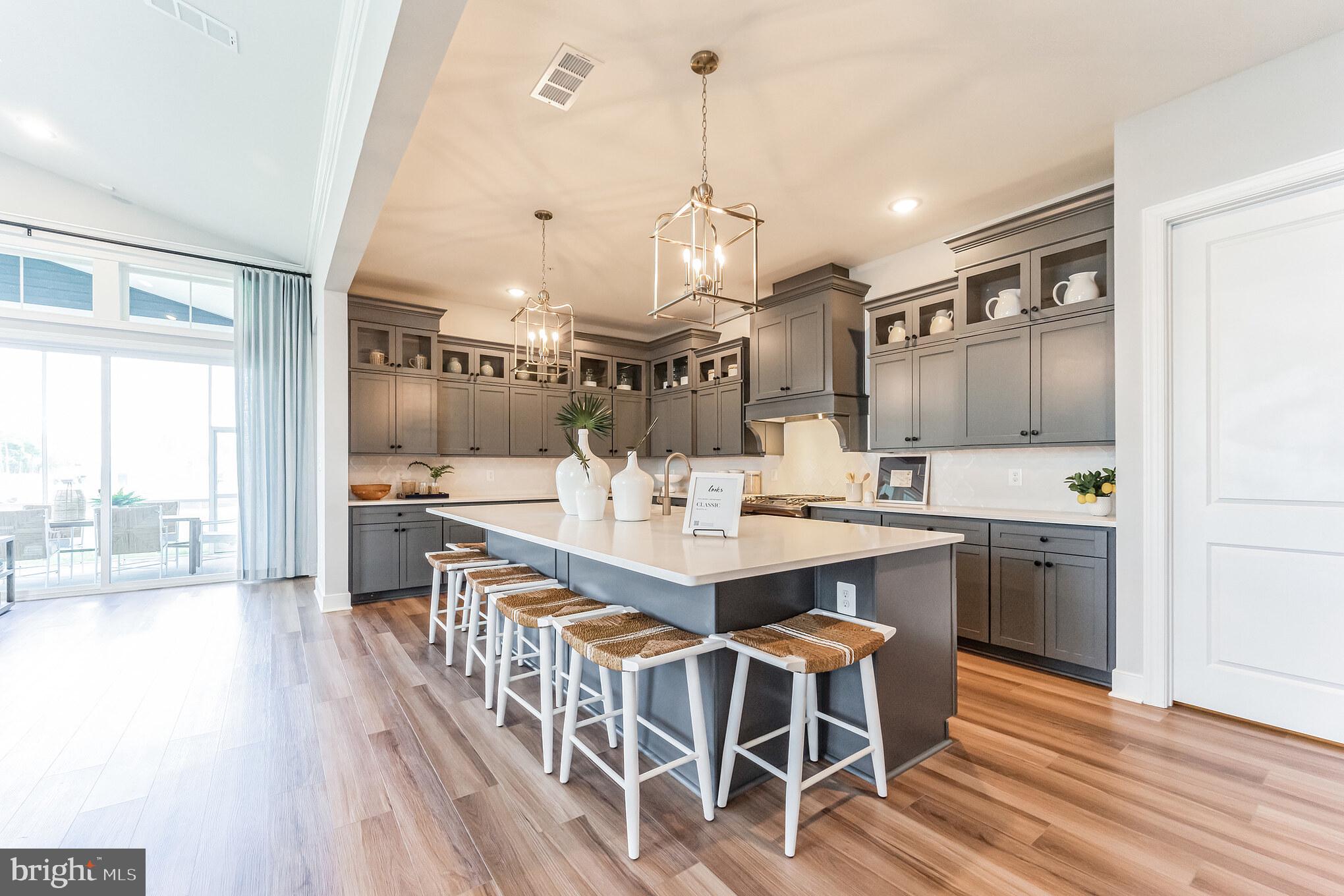 117 Flycatcher Way Stevensville, MD 21666 - Photo 8 of 49 a large kitchen with a table and chairs