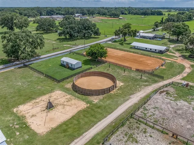 a front view of a house with a garden and yard